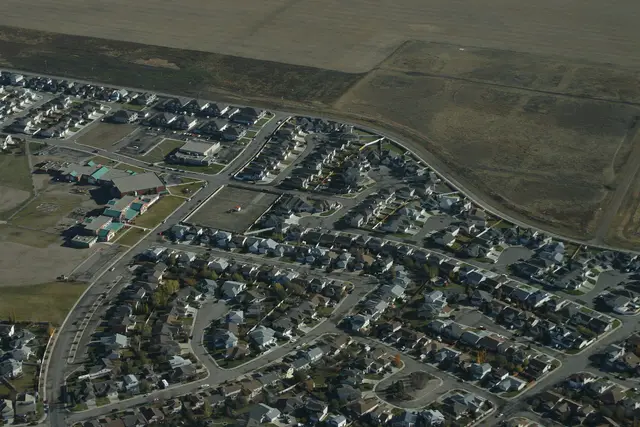 Aerial view of residential neighbourhood and surrounding fields